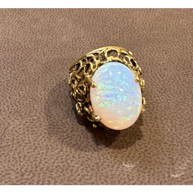 A Huge Cocktail ring Approximately 11 Carat Oval Ethiopian Opal & Diamond Ring 14 Karat Yellow Gold Size 6 This...