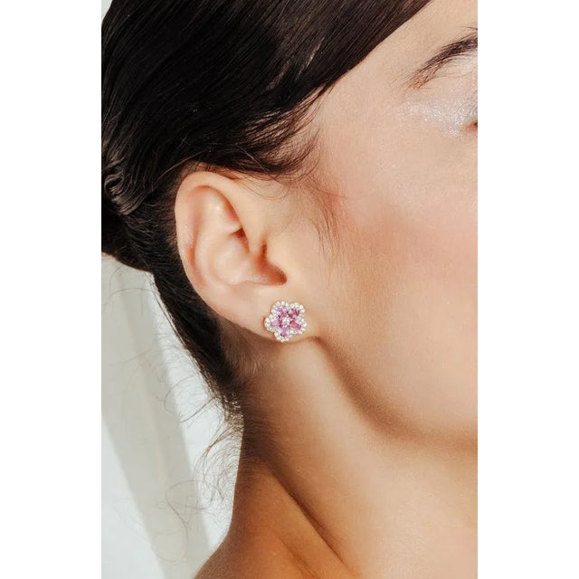 This is part of Chairish’s Fine Jewelry assortment. Cherry Blossom Pink Sapphire and Diamond Flower Stud Earrings in 18K...