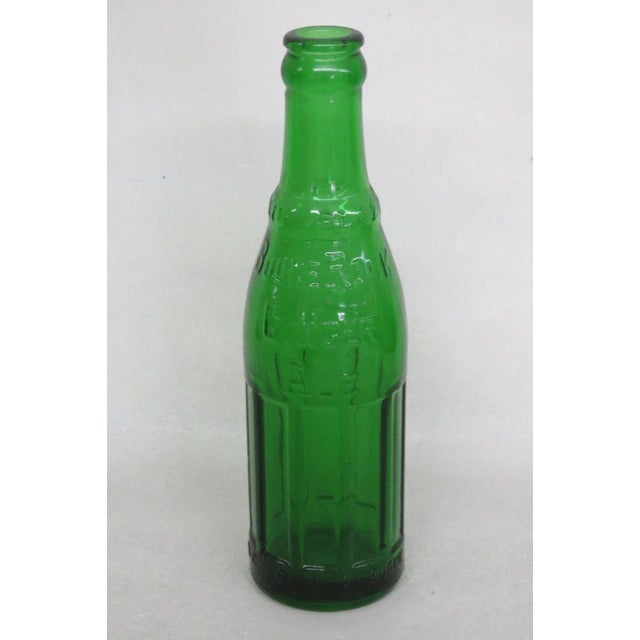 This gorgeous bottle that was around in the 1940's and in great condition. This beautiful piece has a lovely green color...