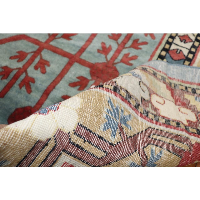 A rare size vintage Khotan rug with Classic large pomegranate design on a teal field from the 3rd quarter of the 20th...
