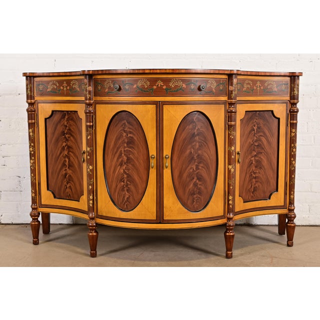 A gorgeous French Regency Louis XVI style sideboard, console, or bar cabinet By Chelsea House Circa Late 20th Century...