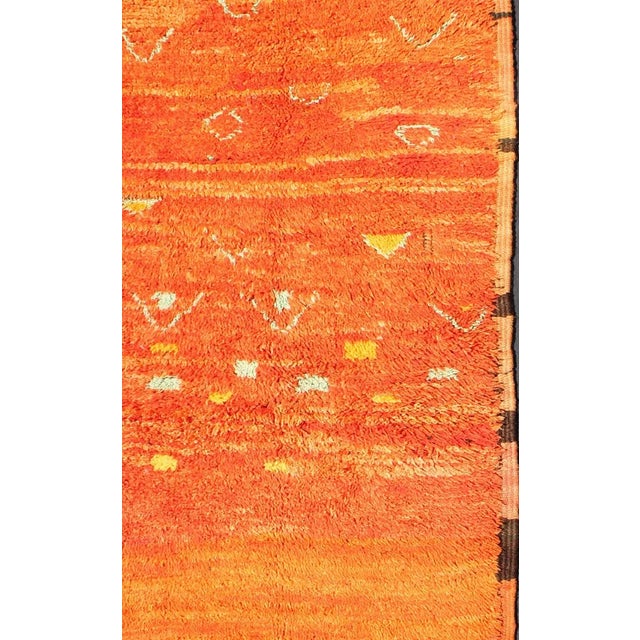 Measures: 3'0'' x 7'0''. This original carpet features intricate symbols based mostly on tribal motifs, with multiple...