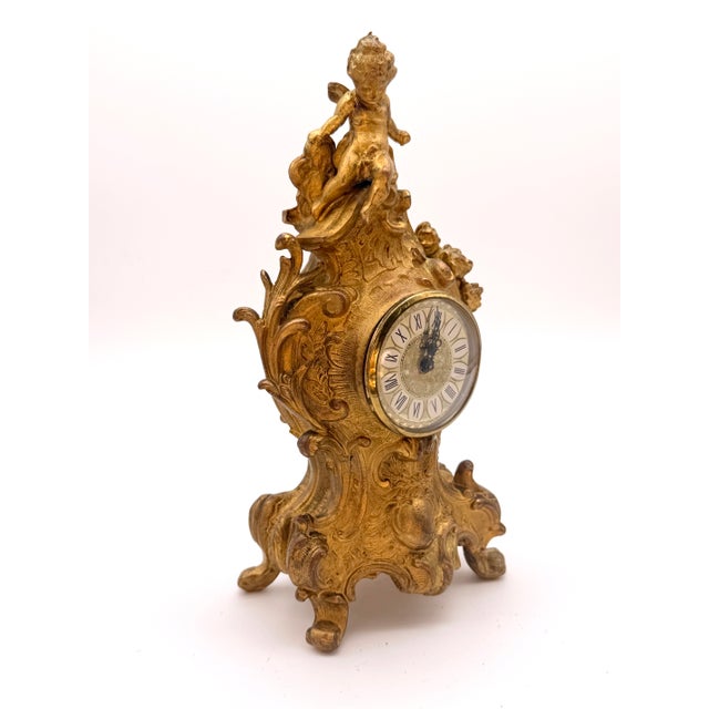An exceptional antique late 19th-century Gilt Metal Boudoir/Mantel Clock designed in the opulent Louis XV Rococo style....