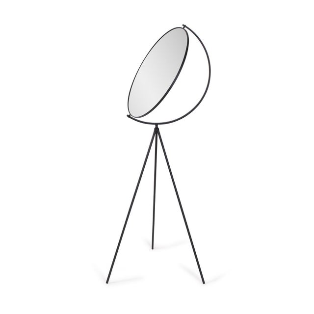 A sophisticated statement piece with its simple and sleek design, this floor mirror features black metal legs supporting a...