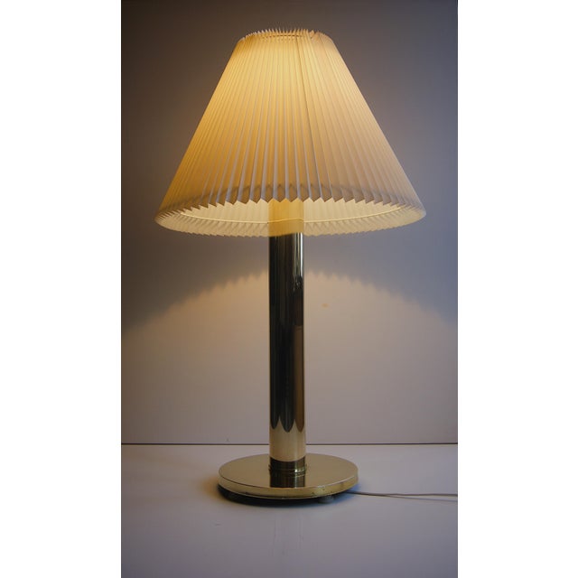 Giant shiny brass table lamp in minimalistic cylindrical column design. Denmark 1960s. Rare large model with the...