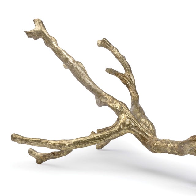 An organic, artful object perfect for your living room, the gold leaf finish on this metal branch adds warmth and depth to...