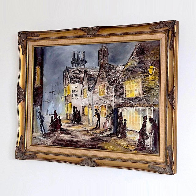 Offered is a framed oil painting depicting a historic British street scene featuring The New Inn (a famous medieval...