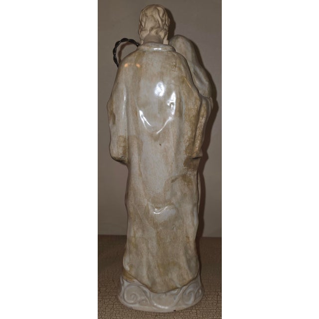 This vintage ceramic Holy Family statue features a sculptural, beige glaze design depicting Jesus, Mary, and Joseph. The...
