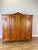An elegant Vintage French Louis wardrobe crafted in Oak , featuring a substantial four-door design with beautifully shaped...