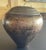 Antique Metal Vase: Measuring approximately 3" in diameter and 10.5" in height.