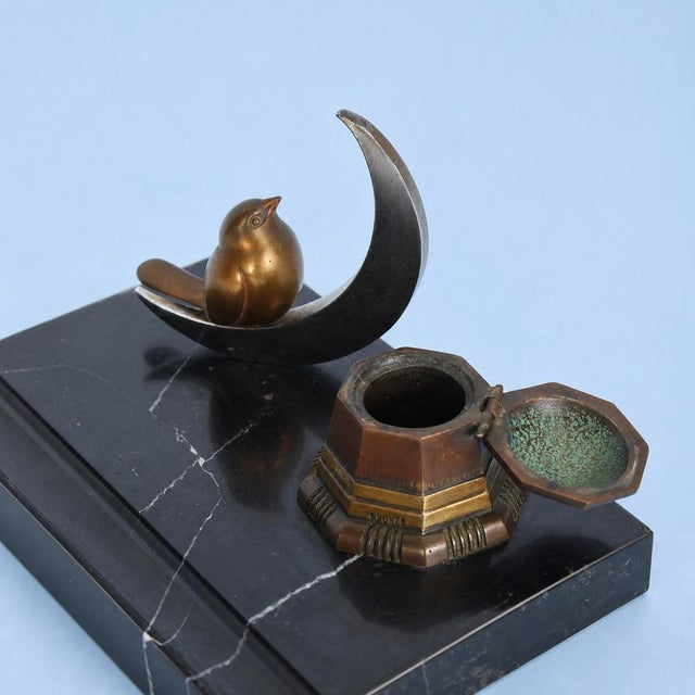 A characterful Art Deco desk tidy, likely dating to around the 1930s. The black marble base incorporates a shallow groove...