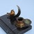 A characterful Art Deco desk tidy, likely dating to around the 1930s. The black marble base incorporates a shallow groove...