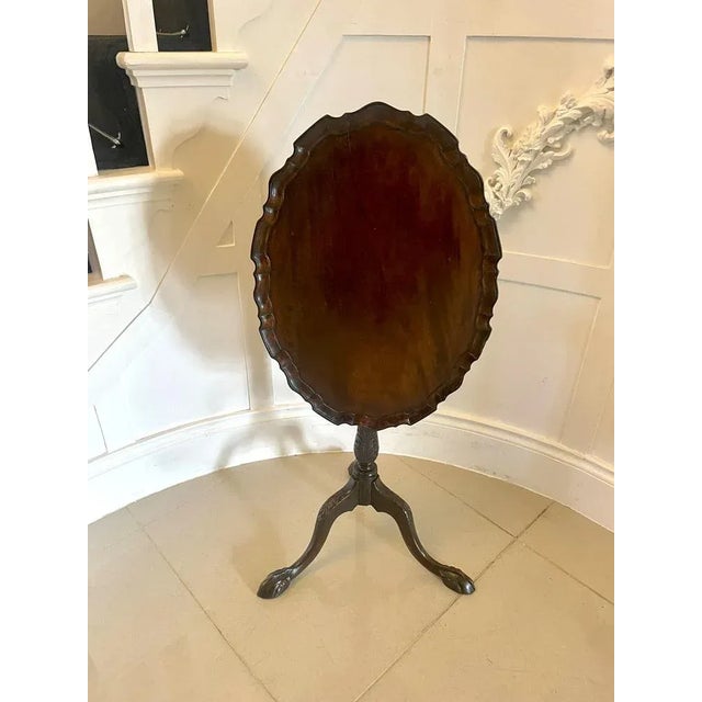 Antique Victorian quality carved mahogany lamp table having a quality mahogany oval shaped tilt top with a moulded edge...