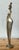 This stunning vintage brass sculpture presents a compelling abstract interpretation of the female form, defined by an...