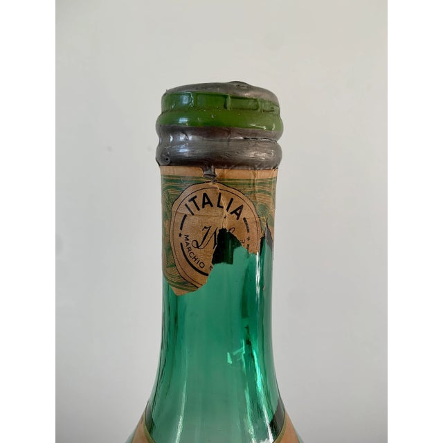 An awesome glass vermouth bottle with original label By Martini & Rossi Italy, Circa Mid-20th Century Measures: 5"W x 5"D...
