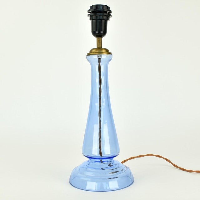 Beautiful cornflower blue glass table lamp by the British company Laura Ashley. The wiring is a complementary shade of...