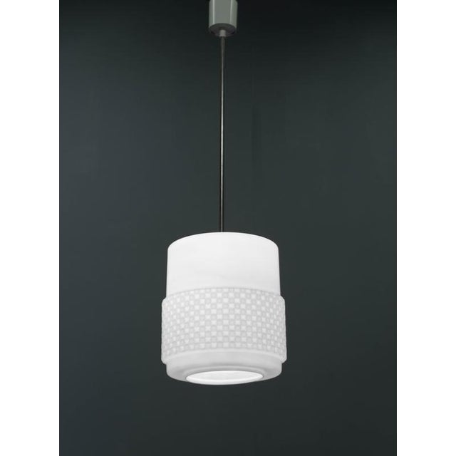 Opaline glass pendant light with geometrical pattern. Made in 1960s in Czechoslovakia. The dimensions of glass: height...