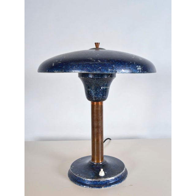 This charming german desk lamp has a real presence, with its wide mushroom shade sitting atop a copper stem. The lamp - in...