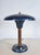 This charming german desk lamp has a real presence, with its wide mushroom shade sitting atop a copper stem. The lamp - in...
