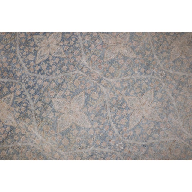 1900 Persian Kerman Rug withe a exquisite all over floral design on a blue field. Peach, cream, caramel are the...
