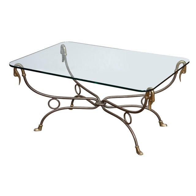 A fine French low cocktail or coffee low table from the Mid-Century Modern era, in the manner of Maison Jansen - featuring...