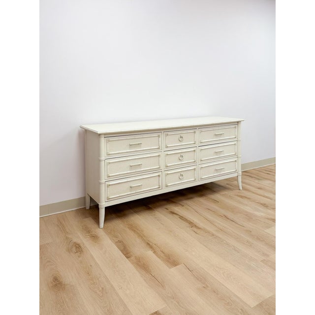 This stunning vintage Thomasville Paoletti collection faux bamboo 9-drawer dresser is a genuinely exceptional Hollywood...