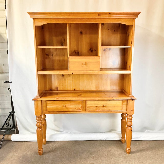 This hutch is stunning and timeless. Crafted from knotty pine, it’s finished in a deep honey color. It transports in two...