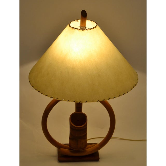 Boho Chic Coastal style bent Bamboo and Caning wrap Table Lamp with original hand-crafted Goatskin Shade. This rare Mid-...