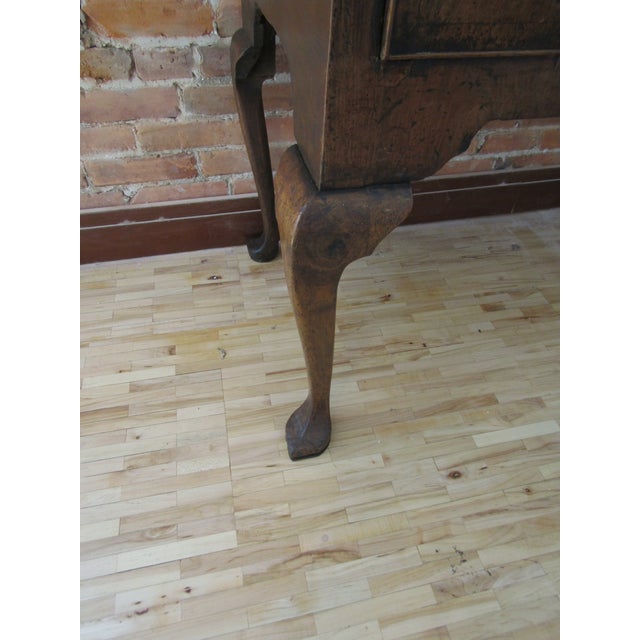 A George I Highboy of small proportions and highly original, the exterior in highly figured Walnut veneers, dating from...