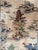 Hand-knotted wool and silk rug measuring 4'0" x 6'0" (48" x 72"), featuring a pictorial landscape design with pagodas,...