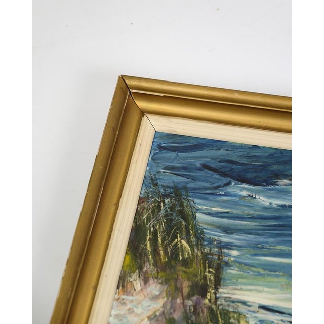 Oil Painting with the motif of the coast, the sand dunes and the sea in the background in windy weather with a dark blue...