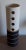 Vintage table lamp in the form of a cylindrical column with side openings made of ceramic with pattern in beige-brown...