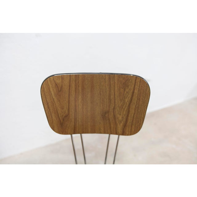 Pair of 1970s Formica chairs with brown Eiffel-style legs and concealed backrest fixings. They are in very clean...