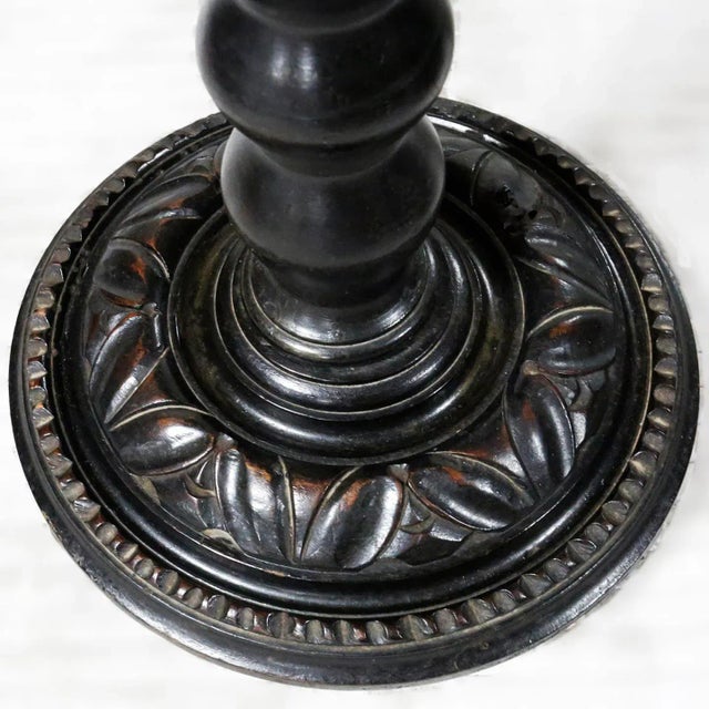 Early 20th century, European turned wood pedestal. Features a hand carved base.