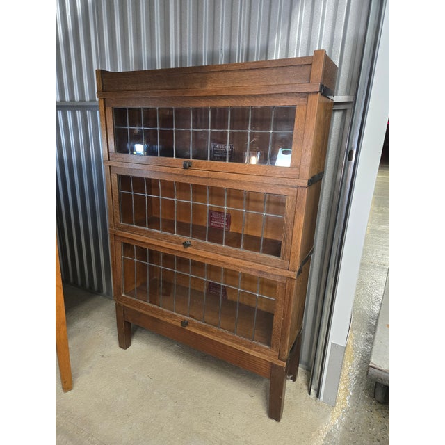 This Arts & Crafts-style bookcase was made by Globe-Wernieke Company of Cincinnati, Ohio (see photo of maker's label...