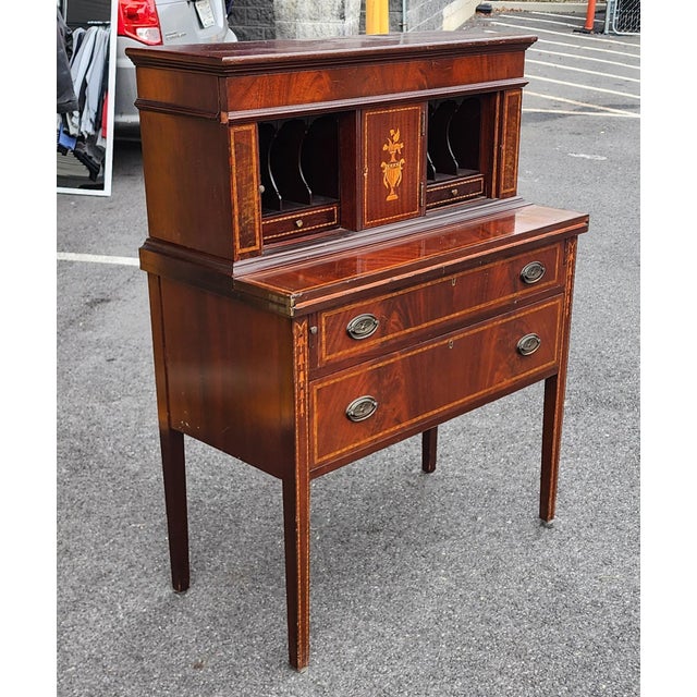 This is a very good quality early 20th century inlaid mahogany American federal style ladies tambour door writing desk or...
