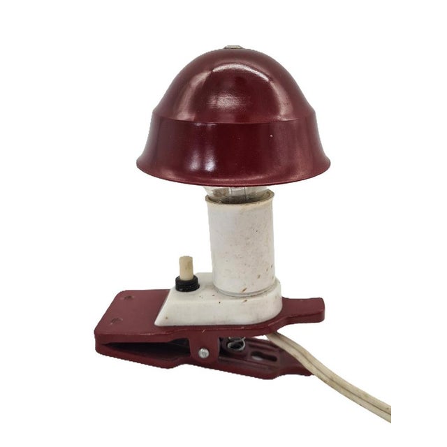 An original clip-on lamp in the Space Age / Mid-Century Modern style from the 1970s. Its distinctive mushroom shape and...