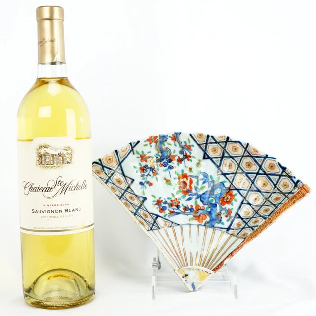 A very old and beautifully hand painted Chinese porcelain dish in the shape of a fan with ribs. The molded porcelain dish...