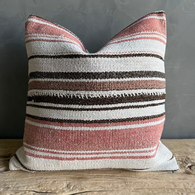 Creamy white hemp rug pillow with stripes. Soft hand, linen blend backing with zipper closure. Spot cleaning is...