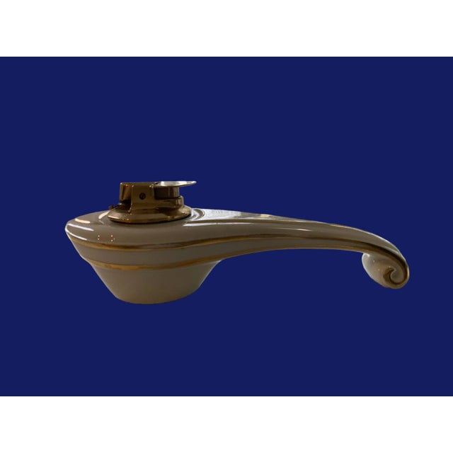 A gorgeous ronson porcelain table lighter. With gold accents. The Ronson Fantasy Veraflame table lighter has beautiful...