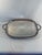 An elegant Silverplated Oblong Platter or Tray with ornate handles and claw feet. Circa 1970s. Made by the well known...