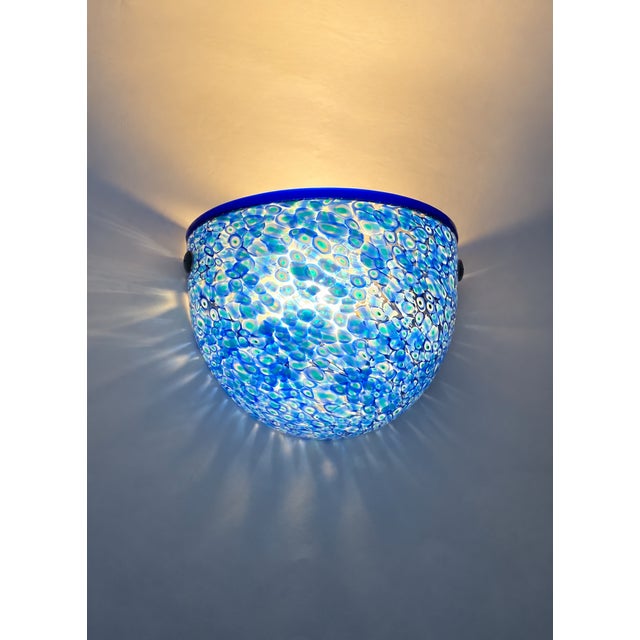 The splendid and exquisite neverrino murano glass wall lamp designed by gae aulenti for vistosi. a synthesis of gae...