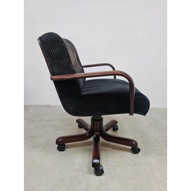 A unique set of five vintage office chairs/meeting chairs. Period: 1970s. It is a comfortable swivel chair in a chocolate...