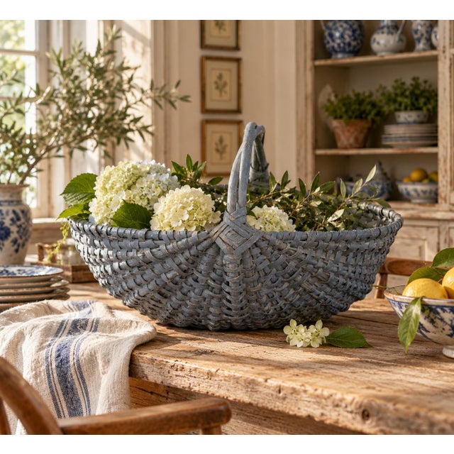 A beautifully woven early 20th century American splint oak basket painted in soft pale blue tones with a tightly...