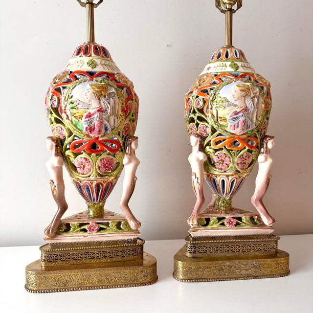 Pair of Italian porcelain hand painted portrait lamps with brass accents and tall silk barrel lamp shades by Benrose...