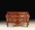 This original Italian antique Bombay chest is crafted entirely in solid walnut and distinguished by its graceful bomb...