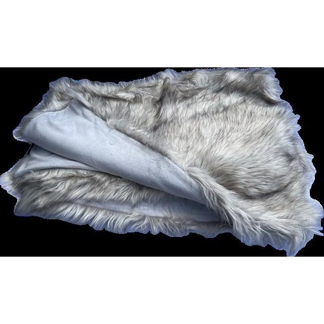 Nobilis faux fur throw. Add warmth and cozy up your reading area, or use as a bed scarf.