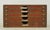 Vintage European paper storage cabinet made of dark stained oak with matching wood knobs on the five drawers. The drawers...