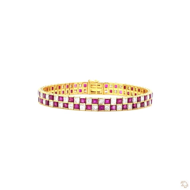 This estate bracelet from our contemporary estate collection centers on a 7.1-carat diamond in a crisp princess cut. It is...