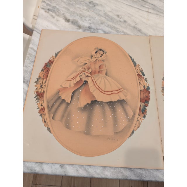 Beautiful pair of vintage lithographs from the artist Bernard. They depict a pair of Southern Belle Women and I believe...